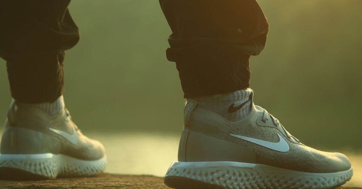 Close-up of Nike sneakers on a person outdoors. Casual lifestyle fashion.